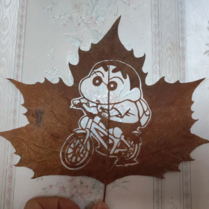 Shin-chan Cycling Leaf Carving – Cartoon Art on Real Maple Leaf
