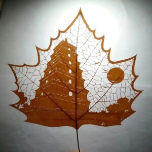 Leaf Carving Art – Ancient Pagoda Under the Sun
